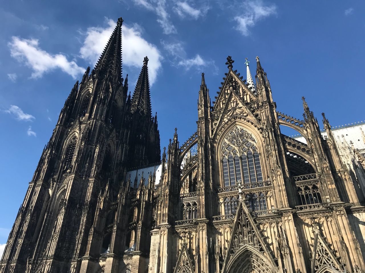 LOW ANGLE VIEW OF CATHEDRAL AGAINST CLOUDY SKY