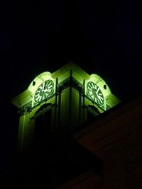Low angle view of illuminated mosque at night