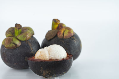 Close-up of fruits in bowl on table