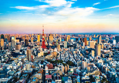 High angle view of modern buildings against sky during sunset