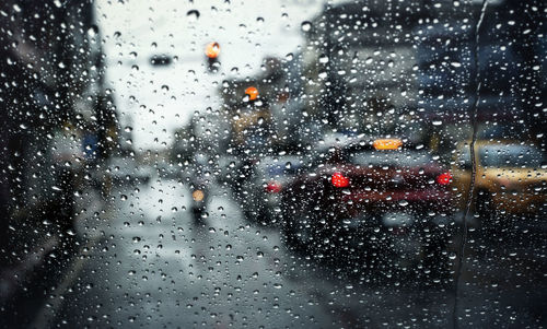 Raindrops on glass window in rainy season