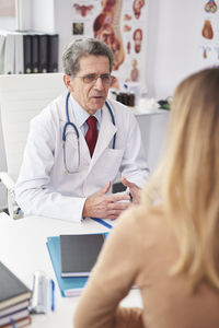 Midsection of man on table