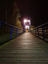 Illuminated footbridge at night