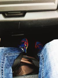 Low section of man sitting in car