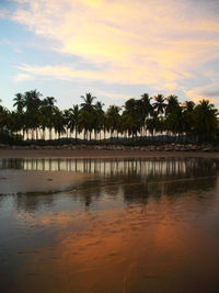 Scenic view of calm sea against cloudy sky