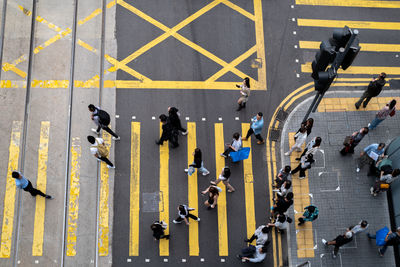 High angle view looking at people crossing the road