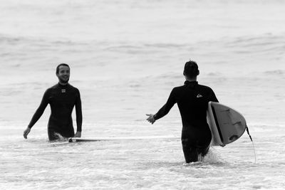 Full length of men on beach