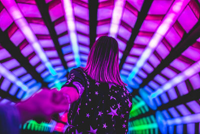 Rear view of woman with illuminated lights