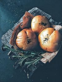 High angle view of breads in basket on table