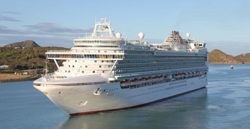 Ship moored on sea against sky