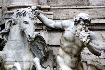 Close-up of horse statue against wall