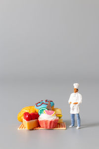 Close-up of figurines against white background