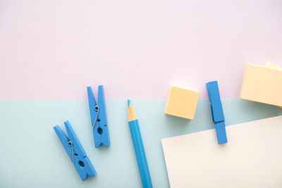 Close-up of colored pencils over white background