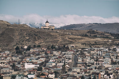 Aerial view of townscape against sky