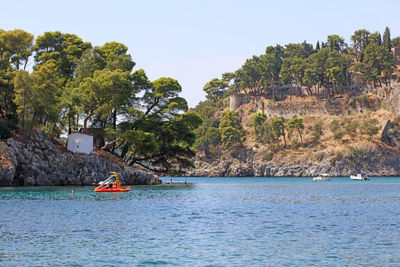 People kayaking in sea