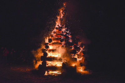 Close-up of bonfire against sky at night