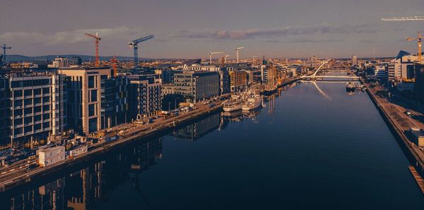 Aerial view of city and buildings against sky