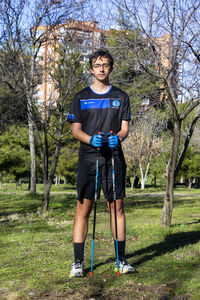 Full length of man standing in forest