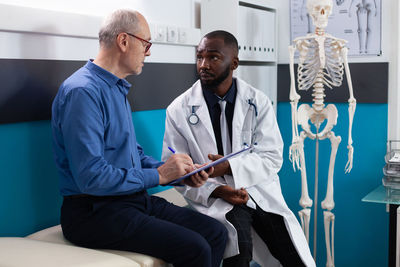 Female doctor examining patient in hospital