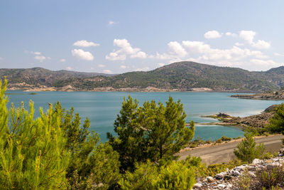 Scenic view at the gadoura water reservoir on rhodes island, greece with blue and turquoise water 