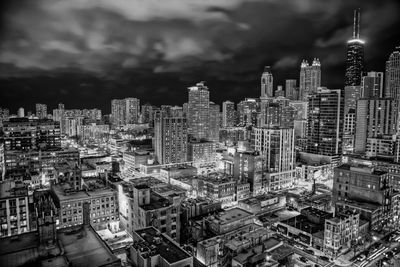 High angle view of modern buildings in city against sky