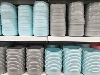 Full frame shot of stacked bowls on shelves in store
