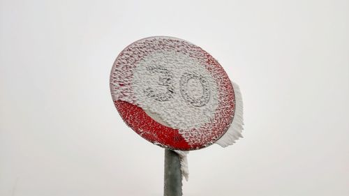 Close-up of crystal ball against white background