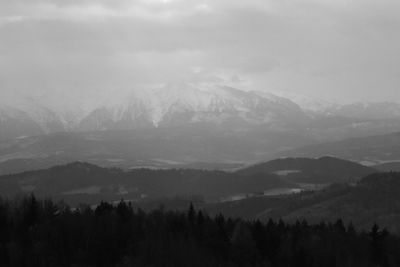 Scenic view of mountains against sky during winter