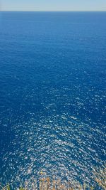 High angle view of sea against blue sky