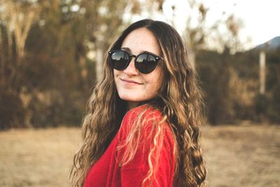 Portrait of smiling woman wearing sunglasses