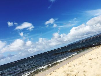 Scenic view of sea against cloudy sky