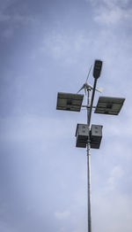 Low angle view of floodlight against sky
