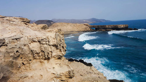 Scenic view of sea against clear blue sky