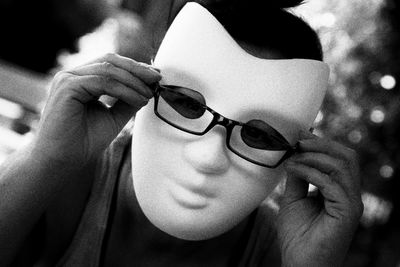 Close-up portrait of young woman wearing sunglasses