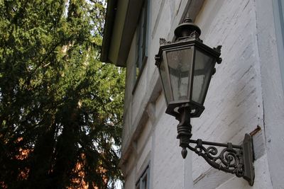 Low angle view of street light against building