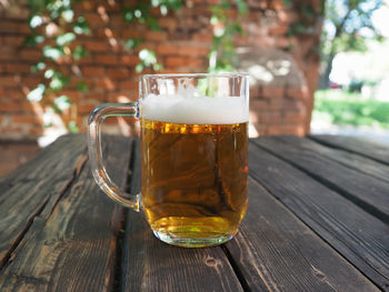 Close-up of beer glass on table