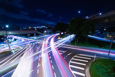 High angle view of light trails on road at night