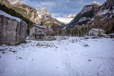 Scenic view of snow covered mountains against sky