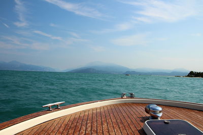 Boat sailing on sea against sky