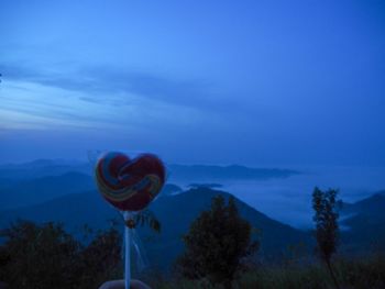 Scenic view of blue and mountains against sky