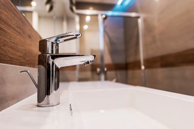 Close-up of faucet on bathroom sink