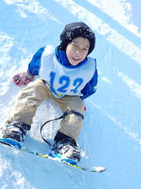 Smiling boy in snow