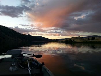 Scenic view of lake against sky during sunset