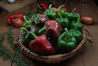 Close-up of bell peppers in basket on table