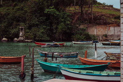 Boats moored in sea