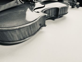 High angle view of piano on table against white background