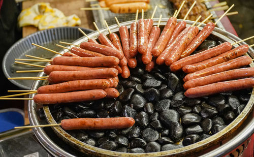 High angle view of meat on barbecue grill