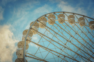 Low angle view of ferris wheel against sky