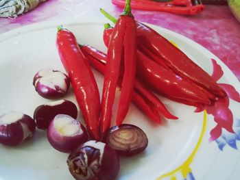 High angle view of red chili peppers in plate