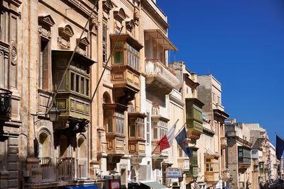 Low angle view of buildings against clear sky